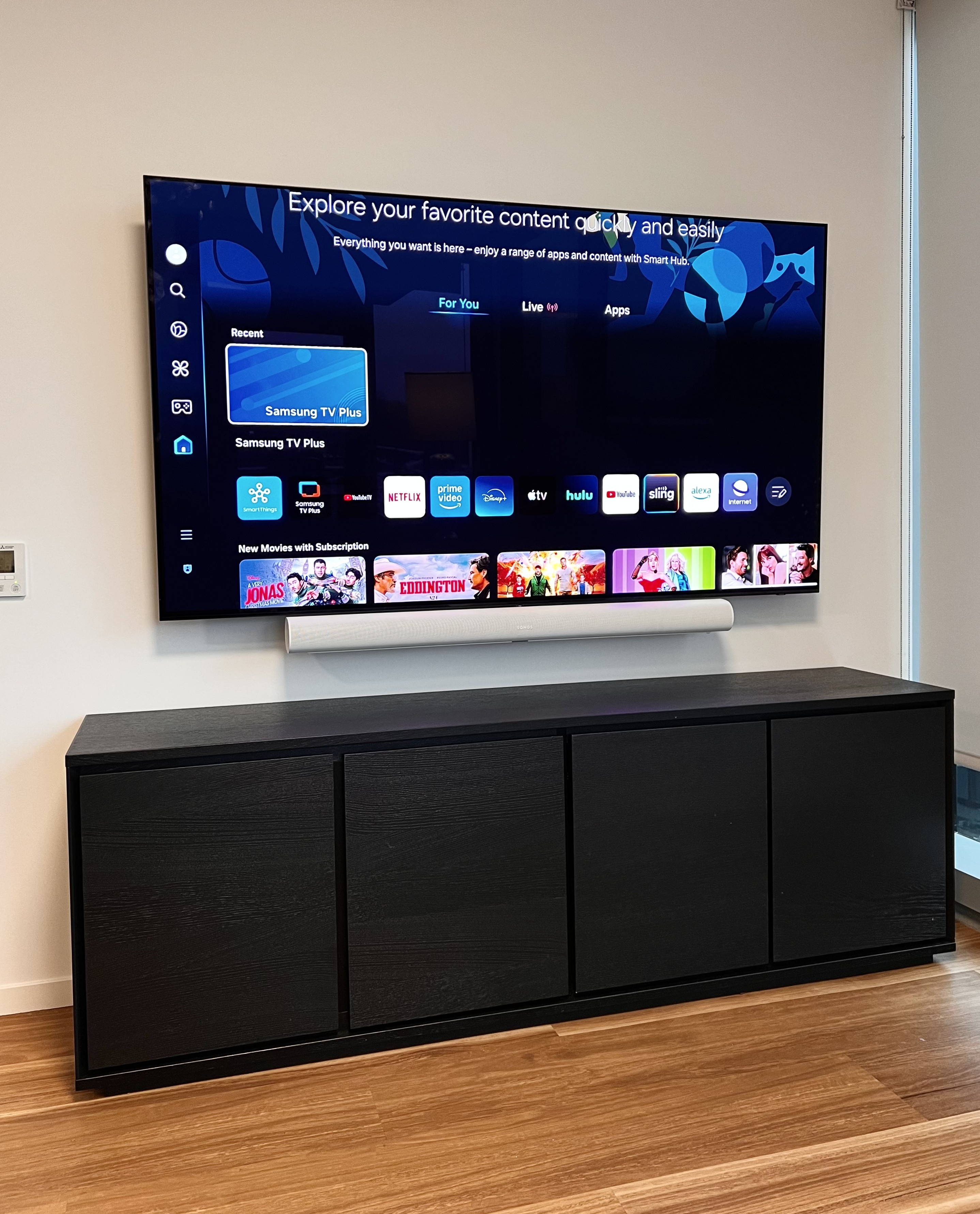 TV mounting with soundbar and clean cable setup